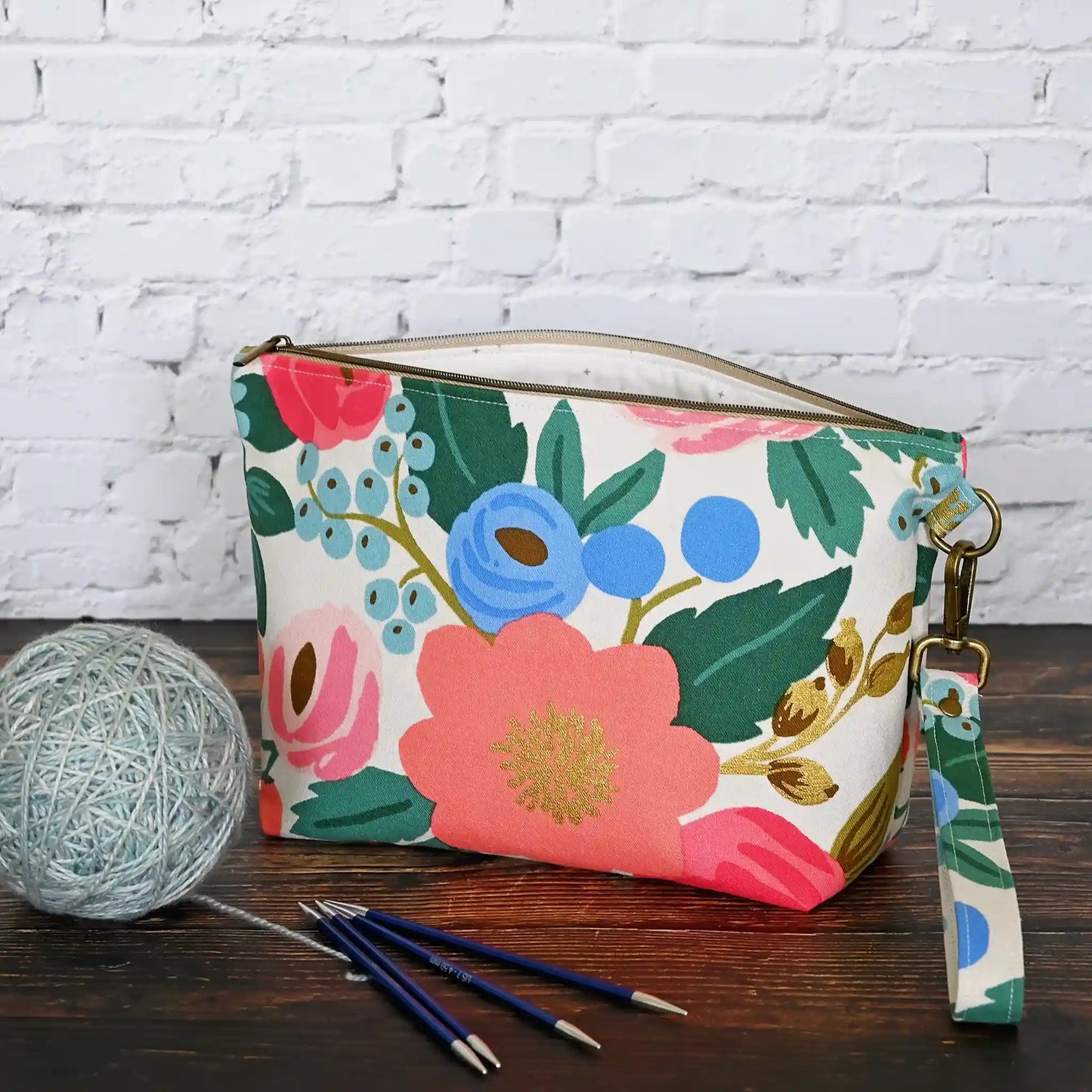 Cream floral canvas zippered pouch with removable wrist strap. Made from Rifle Paper Co's Antique Garden. Handmade in Nova Scotia, Canada.