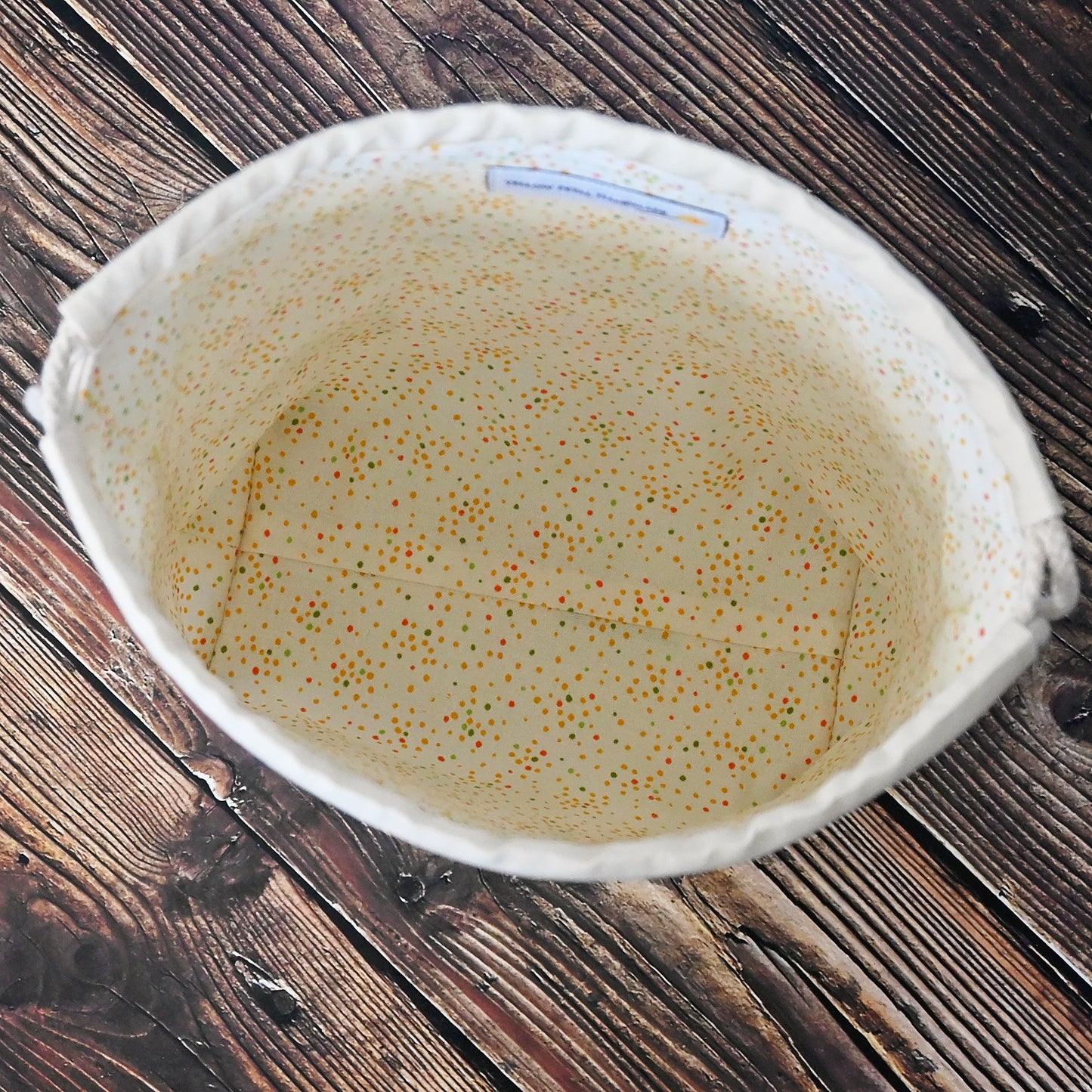 Charming vintage camper inspired drawstring bags with a fun motif of campers and an old station wagon on cream fabric. Lined in a fun multicoloured dotty fabric. Made in Canada by Yellow Petal Handmade.