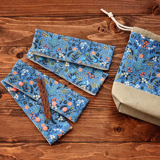 Pretty blue floral DPN cozies, meant to keep your knitting securely on the needles when you aren't working on it.  These are made from a blue floral on the outside and a delicate white floral inside.  They close with your choice of blue or peach snaps.  Made in Nova Scotia, Canada by Yellow Petal Handmade.