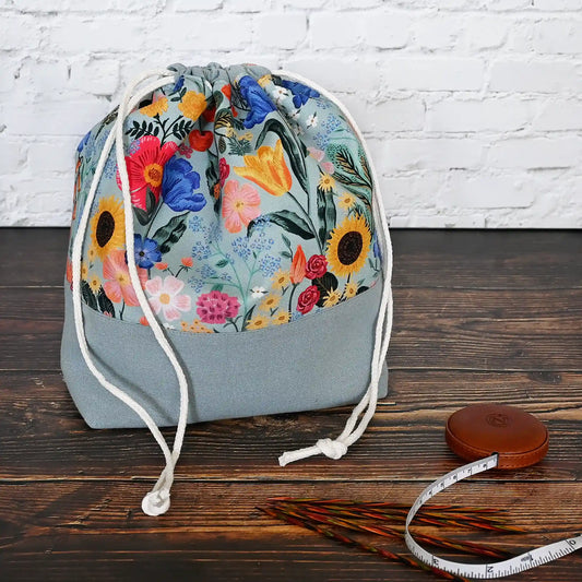 Pretty muted blue grey floral project bag with pockets and a drawstring closure.  This bag is made with Rifle Paper Co's Curio collection, inside and out.  Made in Canada by Yellow Petal Handmade.