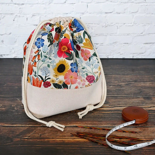 Pretty blush floral project bag in cotton and linen.  Closes with a drawstring and has pockets inside.  This bag is made with Rifle Paper Co's Curio collection by Yellow Petal Handmade in Nova Scotia, Canada.