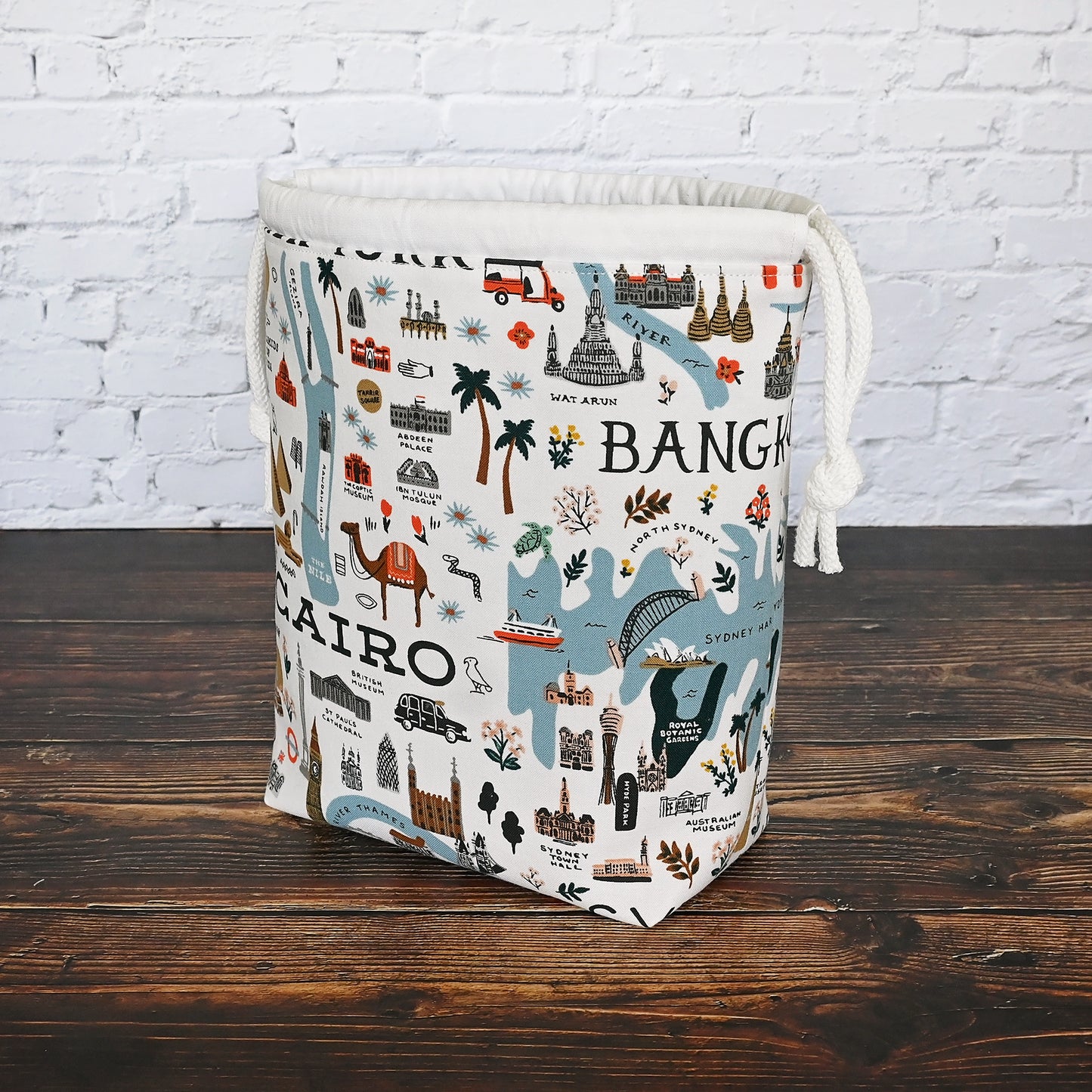 Fun drawstring project bags made from the World Traveller fabric collection by Rifle Paper Co.  Bags come with a pretty floral lining and are available with or without pockets.  Made in Canada by Yellow Petal Handmade.