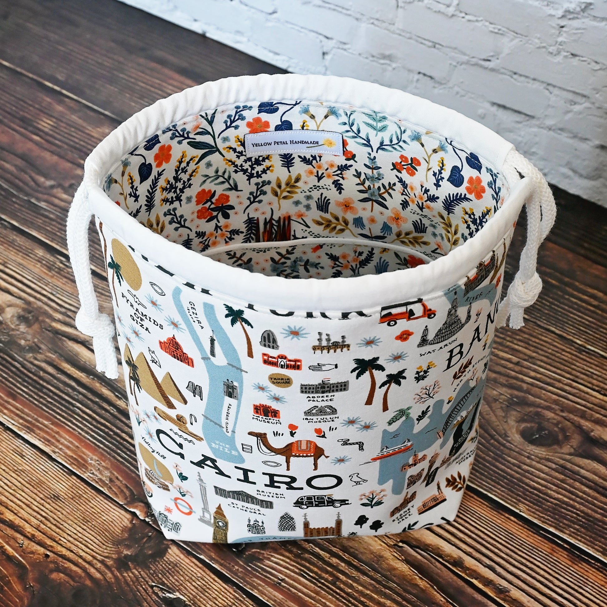 Fun drawstring project bags made from the World Traveller fabric collection by Rifle Paper Co.  Bags come with a pretty floral lining and are available with or without pockets.  Made in Canada by Yellow Petal Handmade.