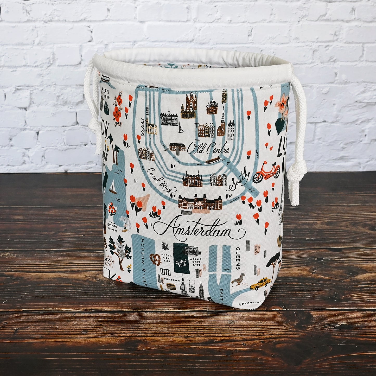 Fun drawstring project bags made from the World Traveller fabric collection by Rifle Paper Co.  Bags come with a pretty floral lining and are available with or without pockets.  Made in Canada by Yellow Petal Handmade.