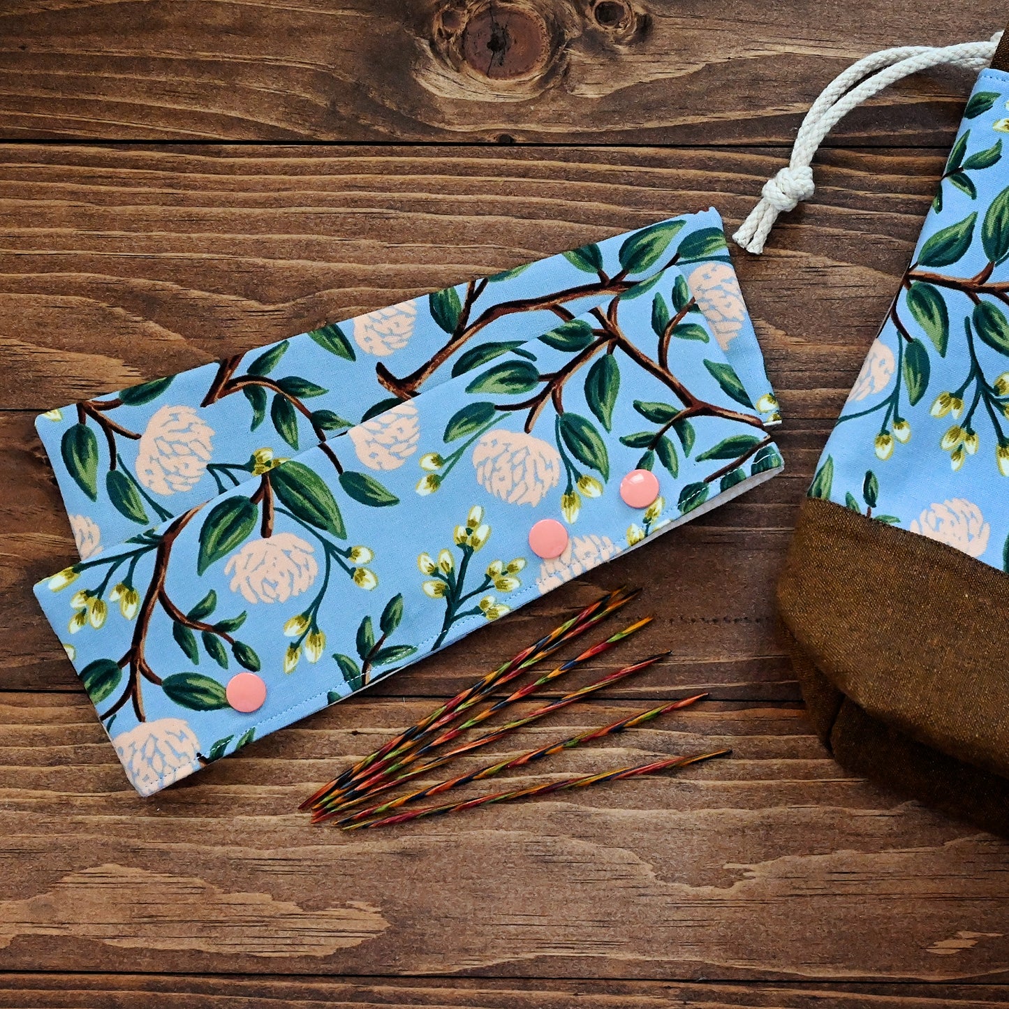 Pretty floral DPN cozies, perfect for keeping your projects on the needles!  Crafted with a blue and peach floral from Rifle Paper Co, these close with snaps and hold your needles (and project) in place.  Made in Canada by Yellow Petal Handmade.