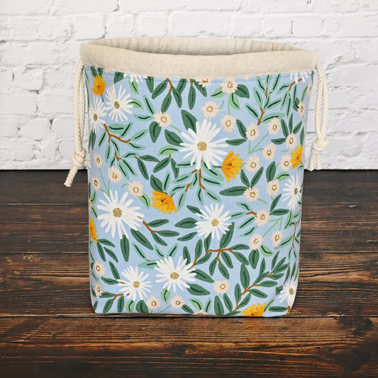 Pretty blue floral project bag made from a lovely canvas by Rifle Paper Co.  Lined in a pretty aqua and closes securely with a double drawstring.  Perfect for small knitting or crochet projects.  Made in Canada by Yellow Petal Handmade.
