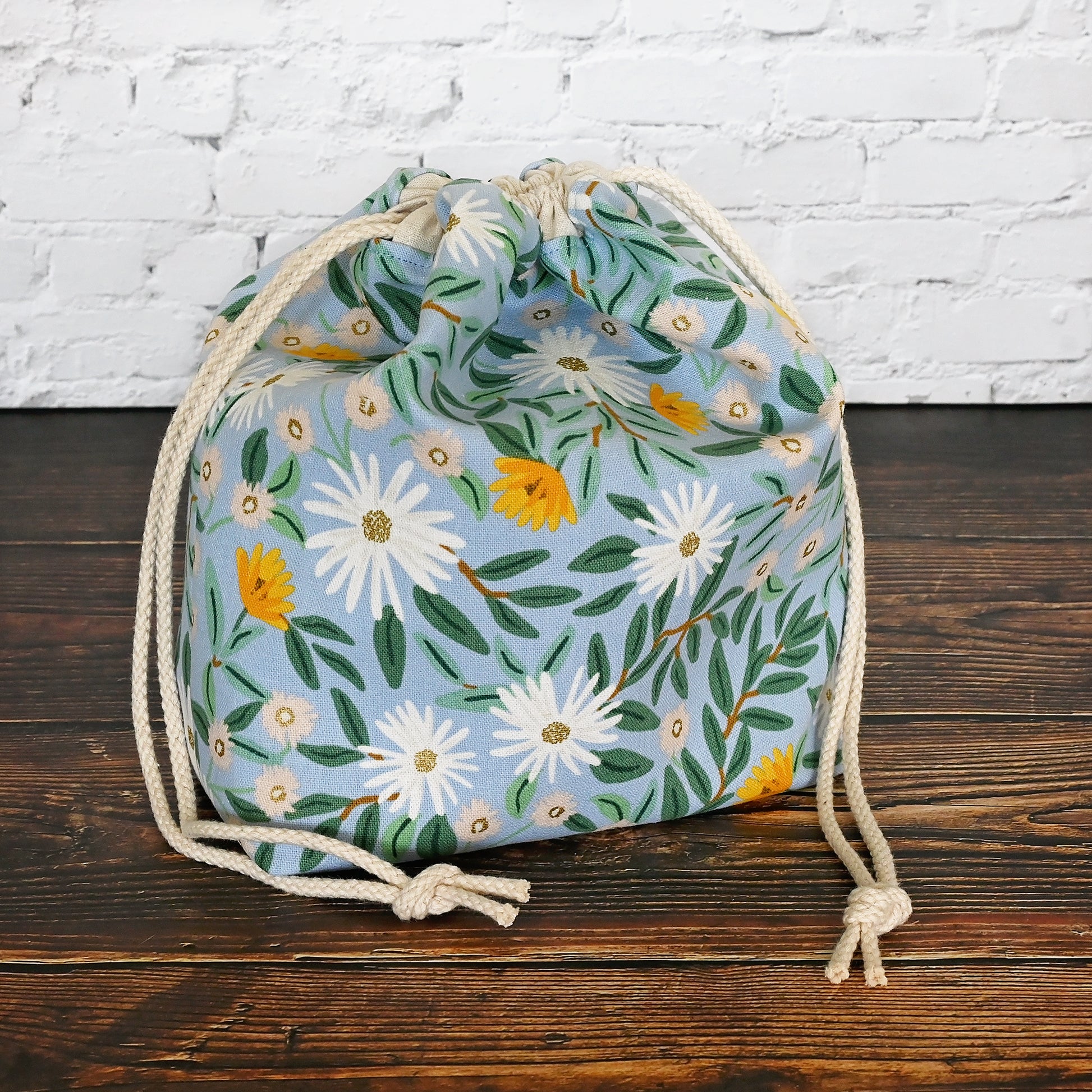 Pretty blue floral project bag made from a lovely canvas by Rifle Paper Co.  Lined in a pretty aqua and closes securely with a double drawstring.  Perfect for small knitting or crochet projects.  Made in Canada by Yellow Petal Handmade.