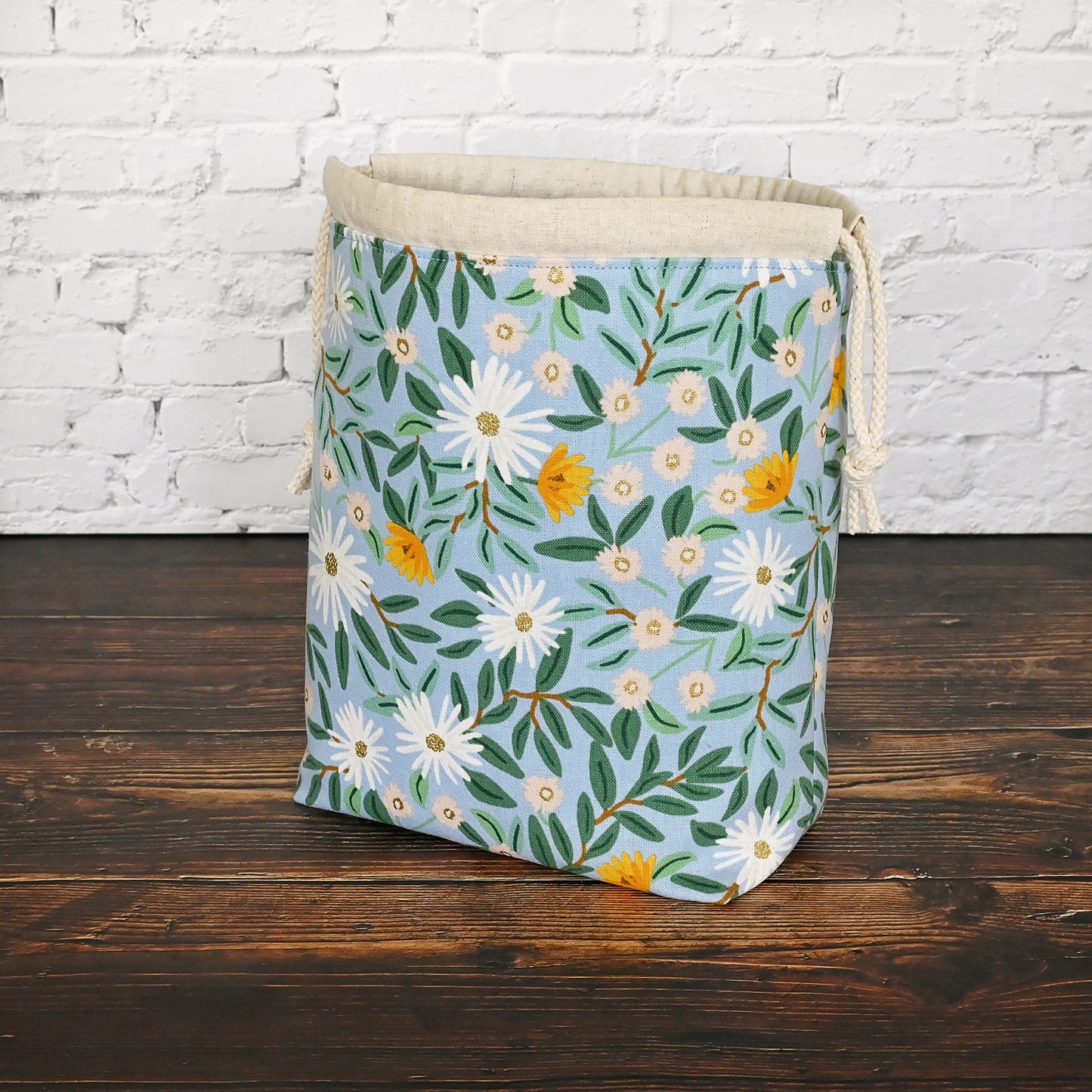 Pretty blue floral project bag made from a lovely canvas by Rifle Paper Co.  Lined in a pretty aqua and closes securely with a double drawstring.  Perfect for small knitting or crochet projects.  Made in Canada by Yellow Petal Handmade.