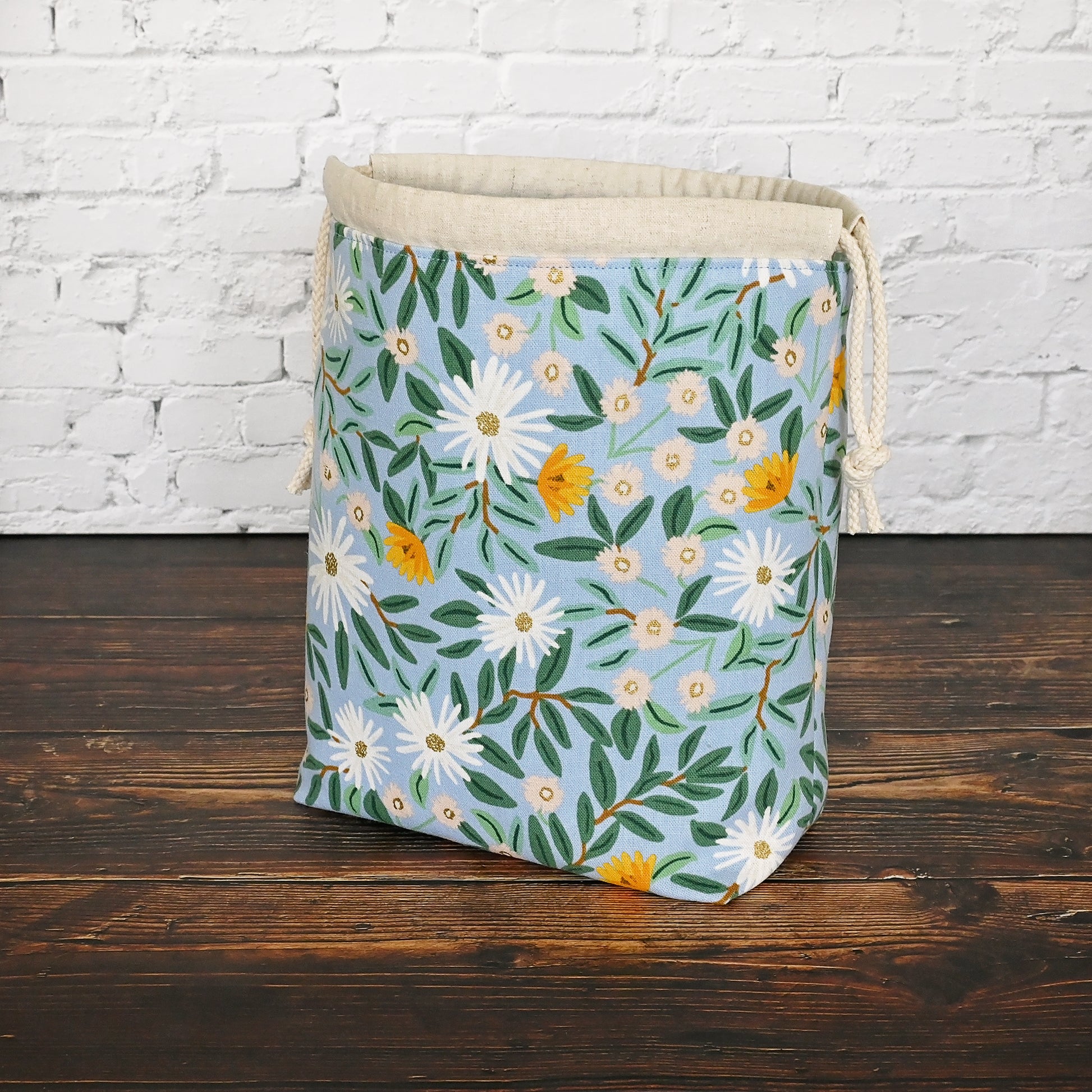 Pretty blue floral project bag made from a lovely canvas by Rifle Paper Co.  Lined in a pretty aqua and closes securely with a double drawstring.  Perfect for small knitting or crochet projects.  Made in Canada by Yellow Petal Handmade.