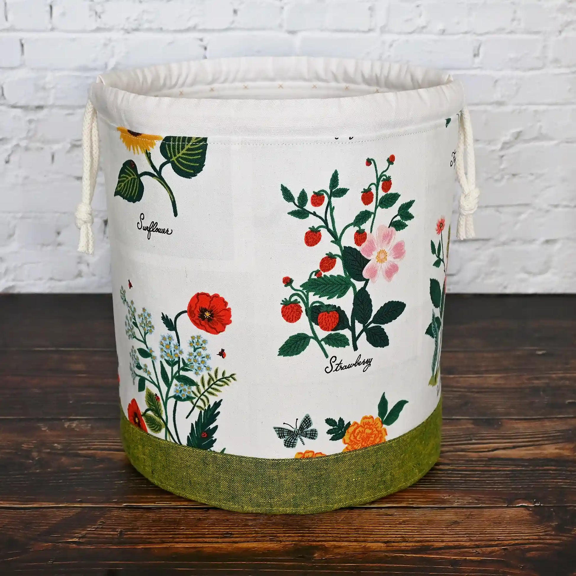 Stunning white floral project bag with green base and tons of pockets!  Great for needlework projects.  Made in Canada by Yellow Petal Handmade using Rifle Paper Co's Curio fabric collection.