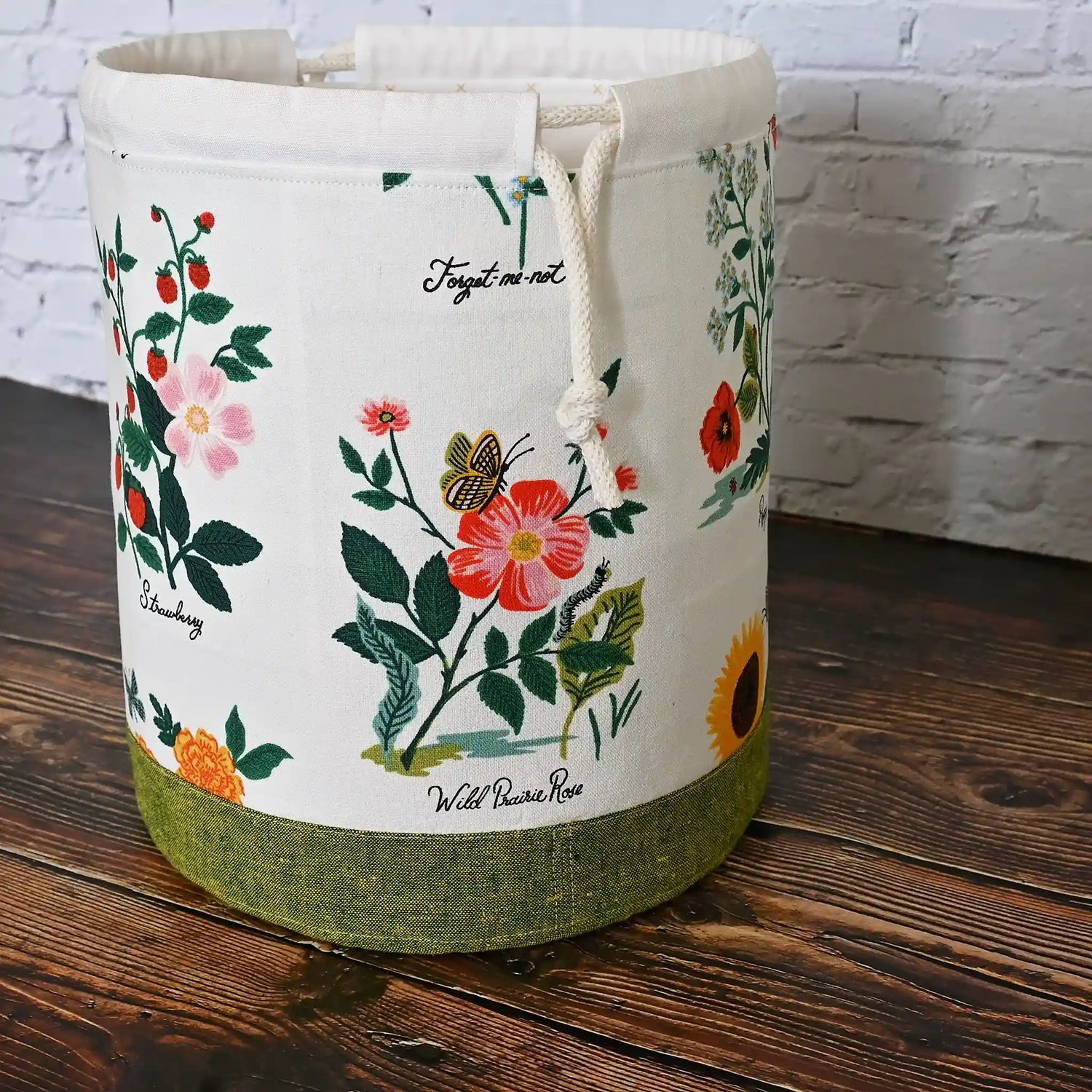 Stunning white floral project bag with green base and tons of pockets!  Great for needlework projects.  Made in Canada by Yellow Petal Handmade using Rifle Paper Co's Curio fabric collection.