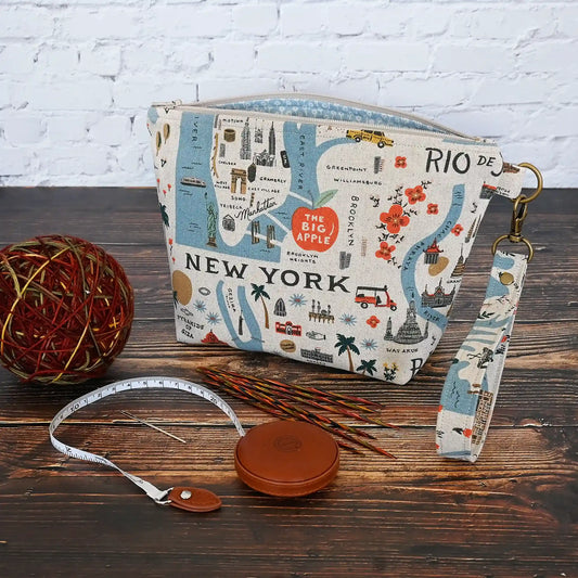 Adorable canvas travel sized project pouch made from Rifle Paper Co's Bon Voyage Collection.  Lined in a pretty blue floral, this pouch is a great size for on the go.  It comes with a removable wrist strap.  Made in Canada by Yellow Petal Handmade.