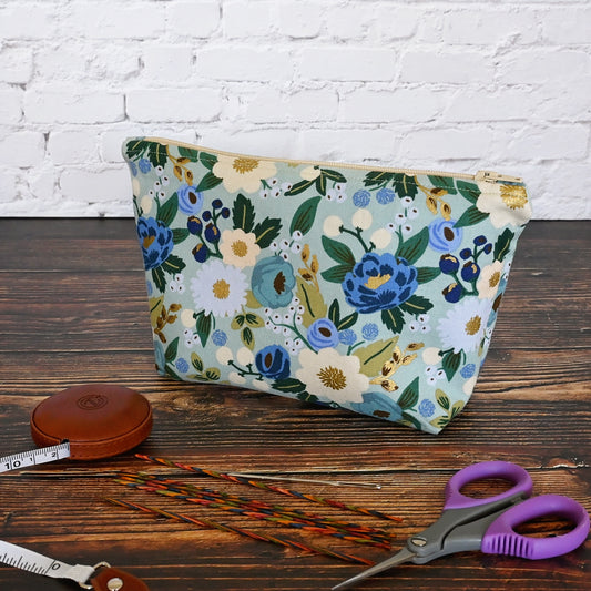 Vintage Garden Accessory pouch in a lovely aqua floral fabric.  Closes with a zipper and is lined in a gold and cream striped cotton.  Made in Canada by Yellow Petal Handmade.