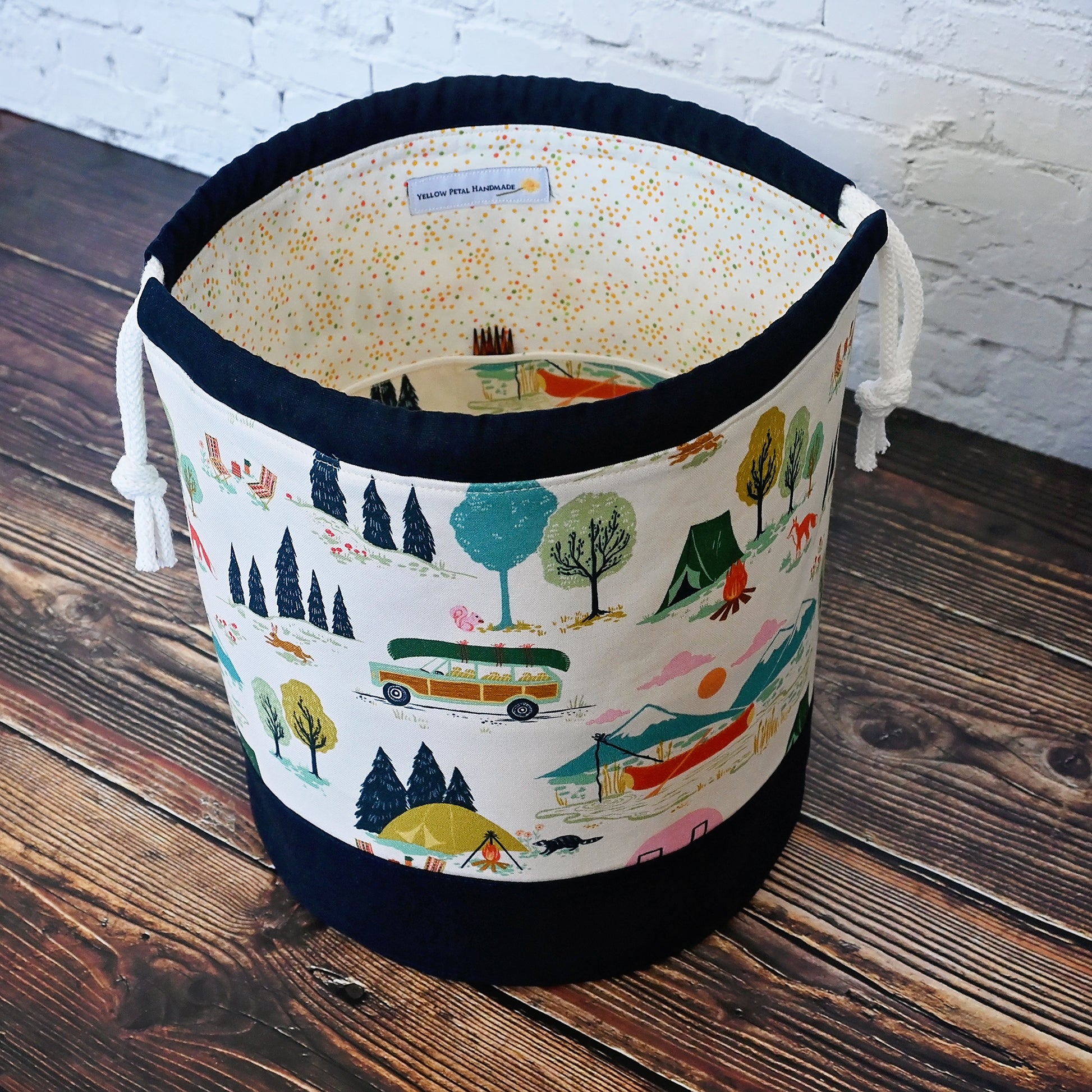 Fun vintage inspired drawstring bucket bag with lots of pockets.  Perfect for knitting or crochet projects.  Made from a fun camper and vintage car themed cream cotton and paired with a navy linen.  Made in Canada by Yellow Petal Handmade.