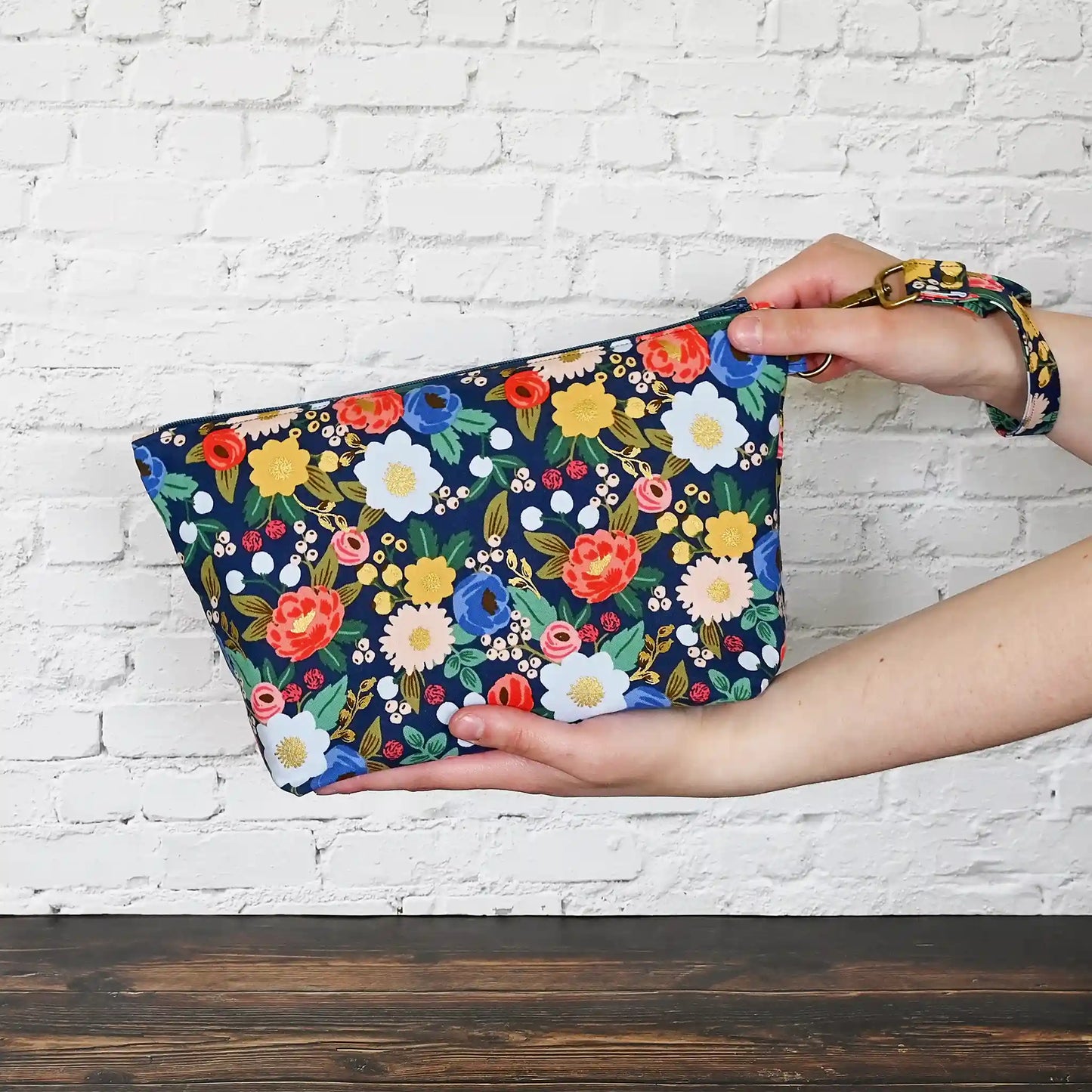 Pretty navy floral project bag with zipper and wrist strap.  Made from Rifle Paper Co's Antique Garden.  Made in Nova Scotia, Canada by Yellow Petal Handmade.