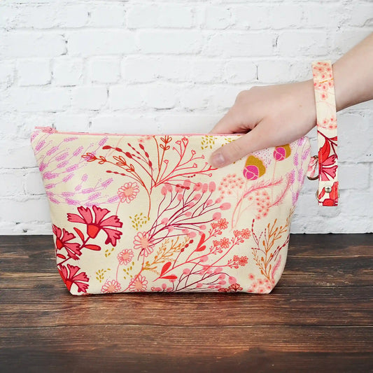 Small zippered project bag in floral canvas.  Comes with removable wrist strap.  Handmade in Nova Scotia, Canada.