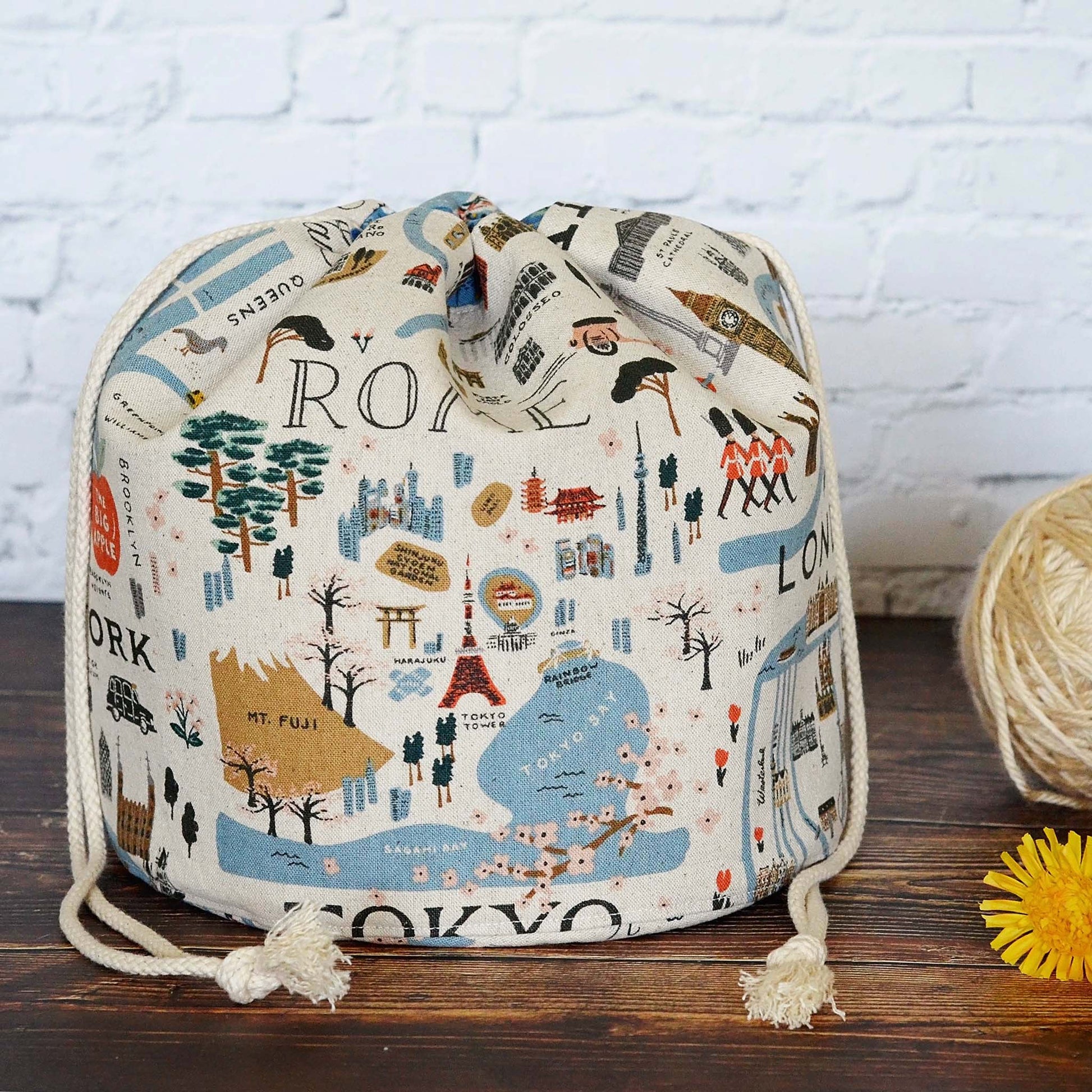 Travel themed bucket style knitting bag with plenty of interior pockets.  Made from the Bon Voyage collection by Rifle Paper Co.  Made in Canada by Yellow Petal Handmade.