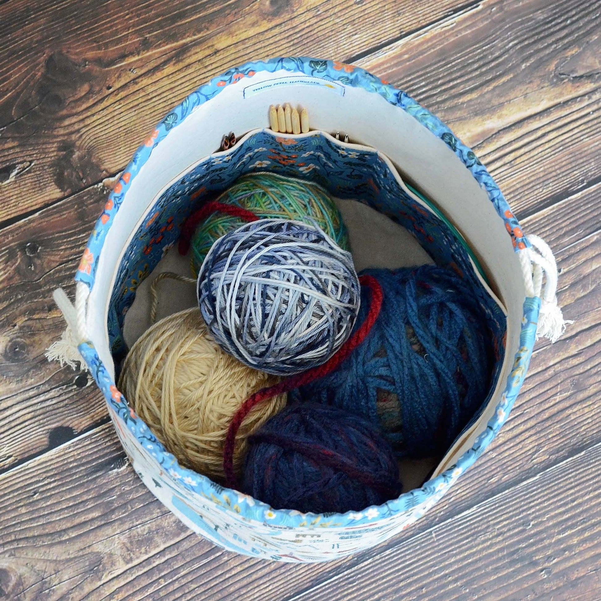  Travel themed bucket style knitting bag with plenty of interior pockets.  Made from the Bon Voyage collection by Rifle Paper Co.  Made in Canada by Yellow Petal Handmade.