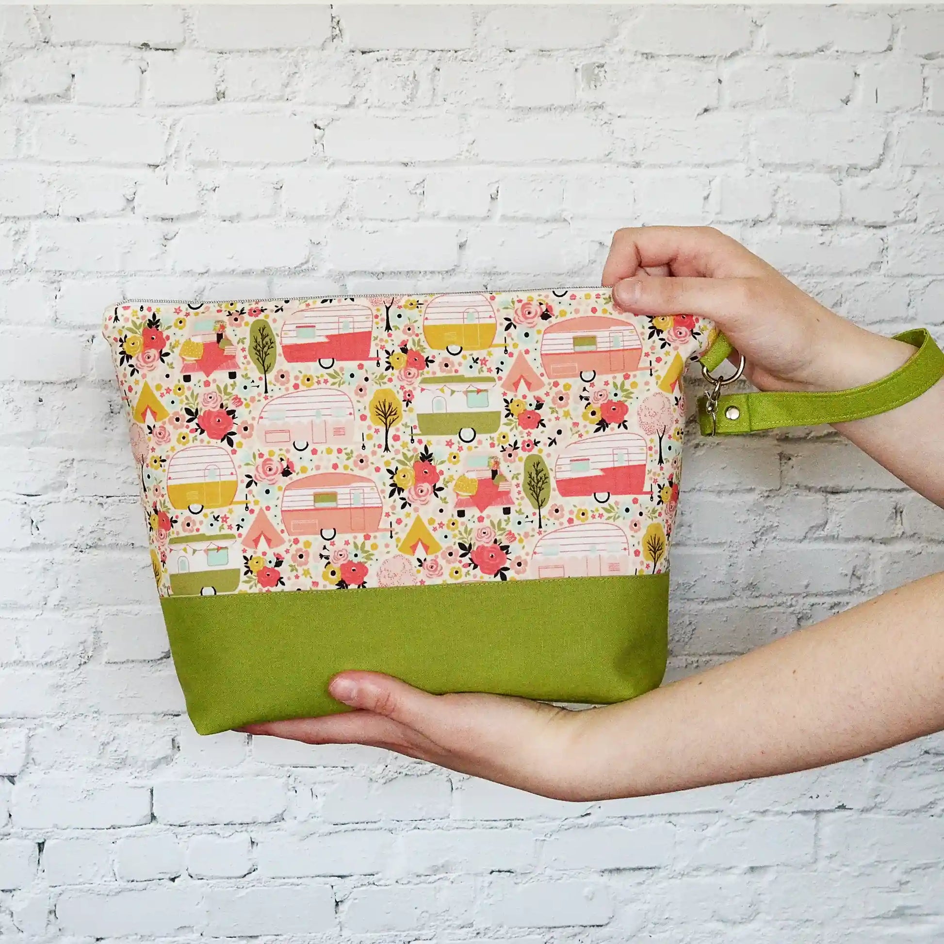 Vintage Camper themed project bag with zipper, pockets and a removable strap.  Paired with a lime green linen and lined in a pretty floral.  Made in Canada by Yellow Petal Handmade.