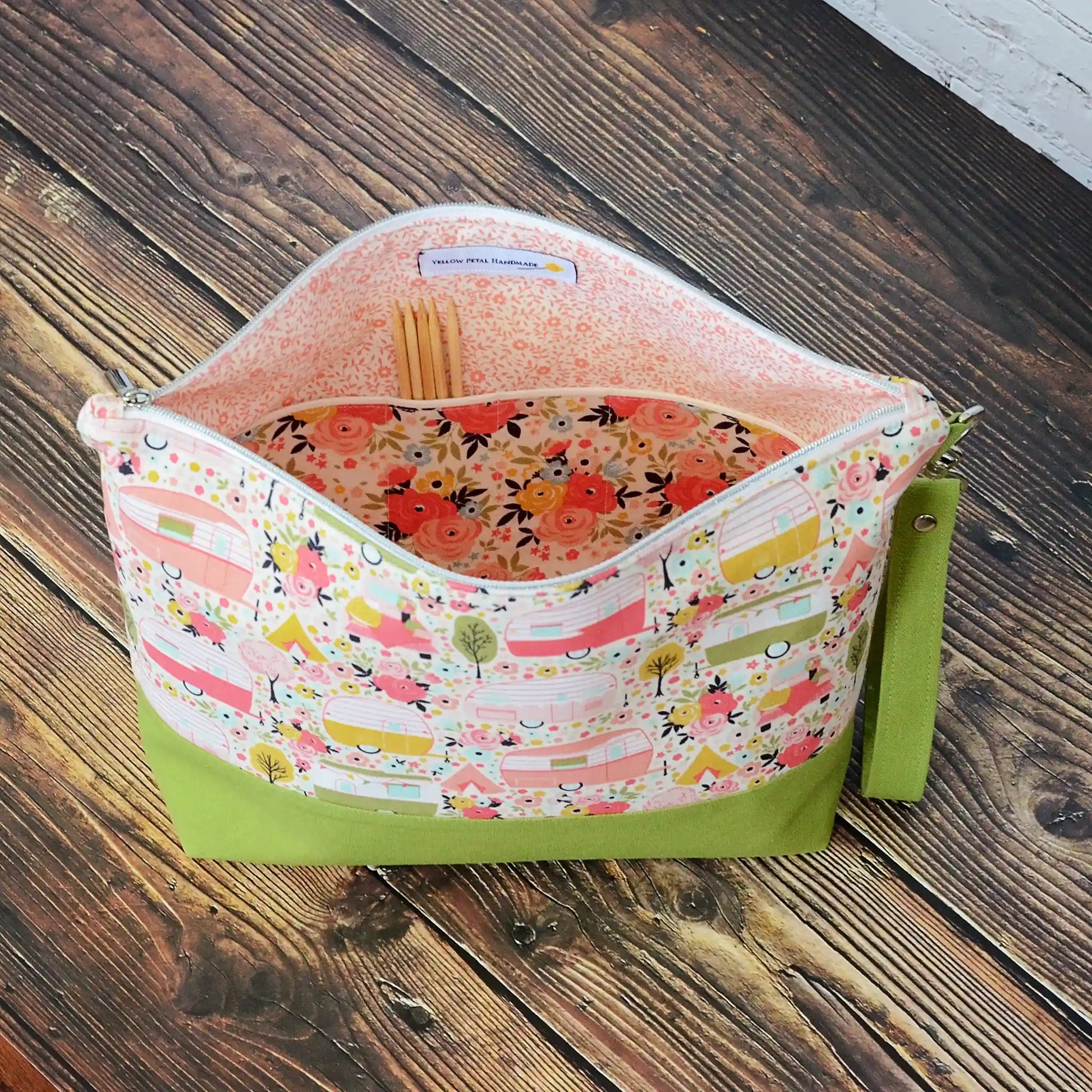 Vintage Camper themed project bag with zipper, pockets and a removable strap.  Paired with a lime green linen and lined in a pretty floral.  Made in Canada by Yellow Petal Handmade.
