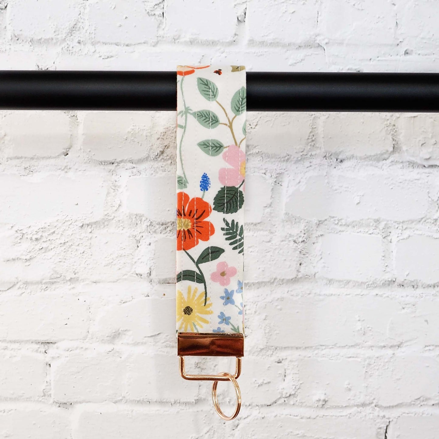 Keychain wristlets in Rifle Paper Co. fabrics and gold hardware.  Made in Canada by Yellow Petal Handmade.