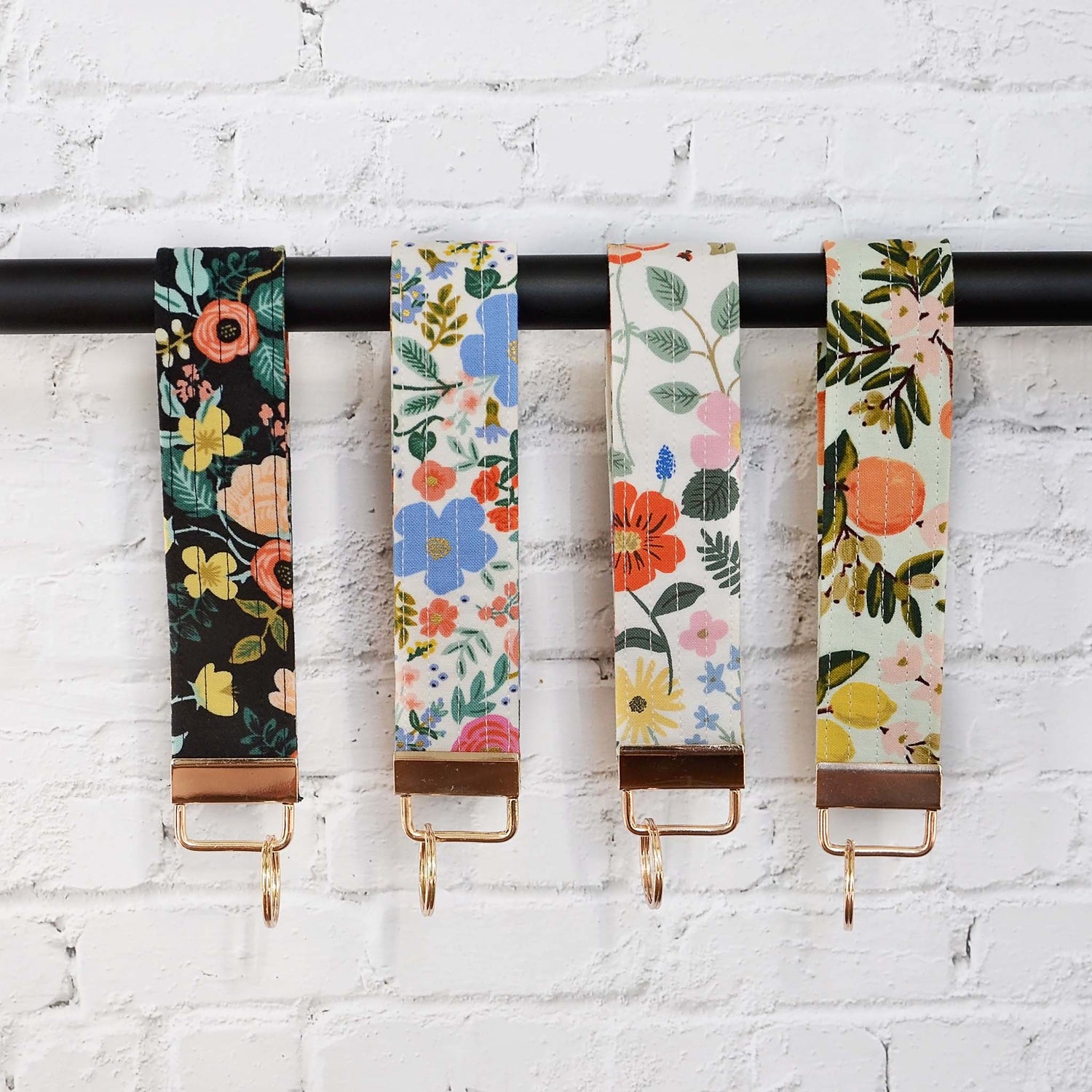 Keychain wristlets in Rifle Paper Co. fabrics and gold hardware.  Made in Canada by Yellow Petal Handmade.