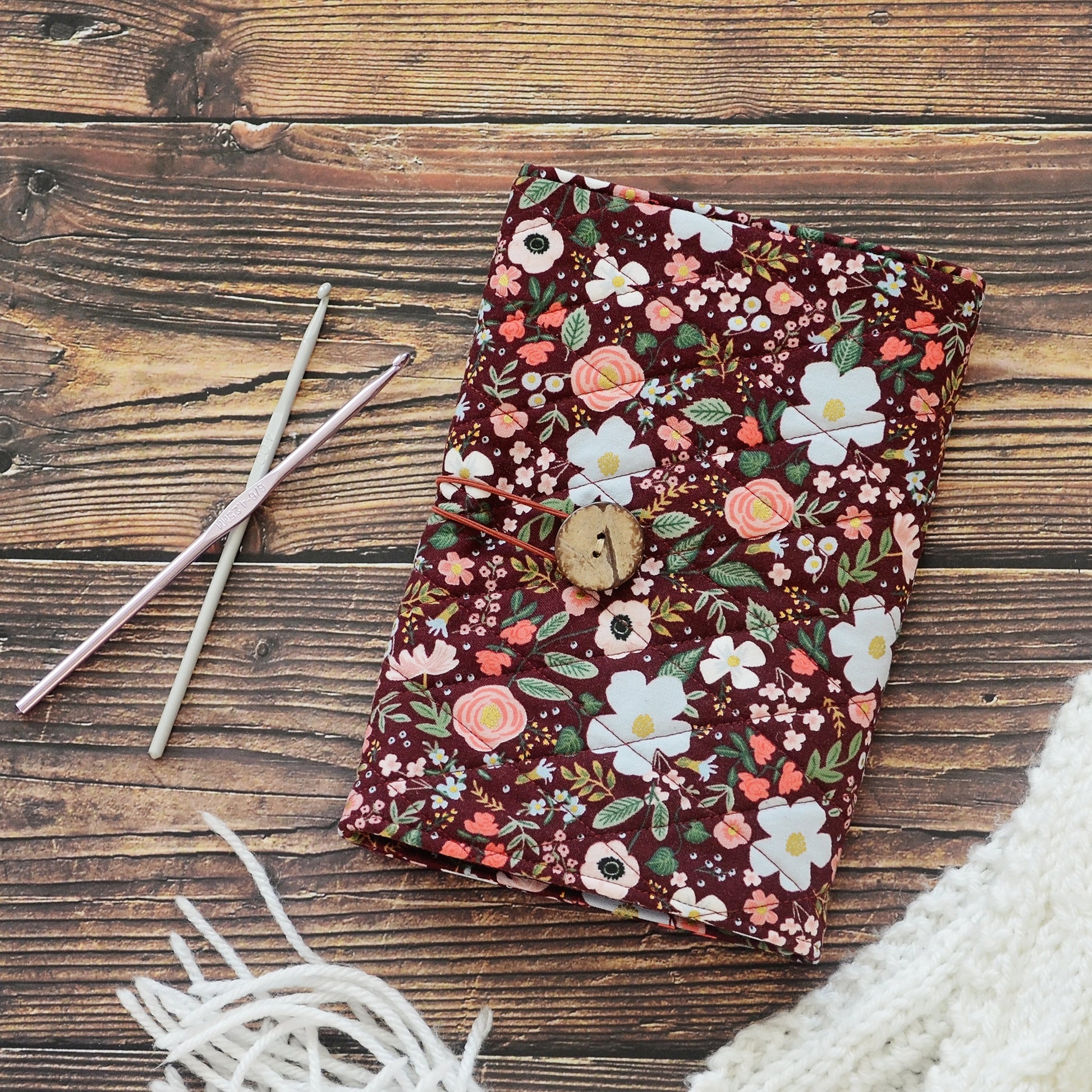Quilted crochet hook wrap in burgundy floral Rifle Paper Co fabric.  Made in Canada by Yellow Petal Handmade.