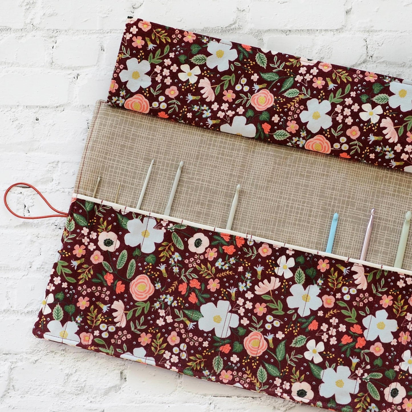 Quilted crochet hook wrap in burgundy floral Rifle Paper Co fabric.  Made in Canada by Yellow Petal Handmade.