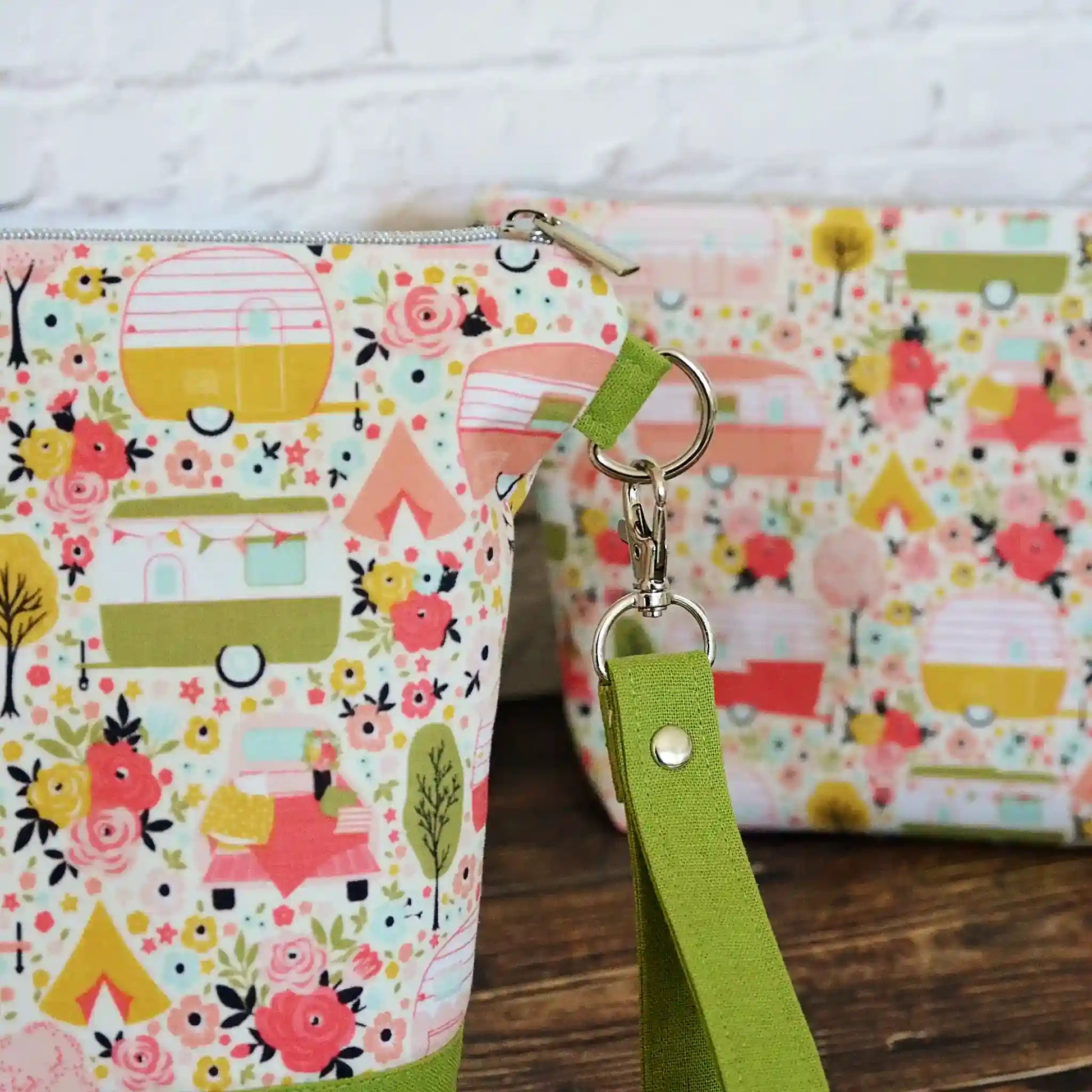 Vintage Camper themed project bag with zipper, pockets and a removable strap.  Paired with a lime green linen and lined in a pretty floral.  Made in Canada by Yellow Petal Handmade.